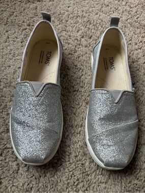 TOMS silver sparkle slip on shoe